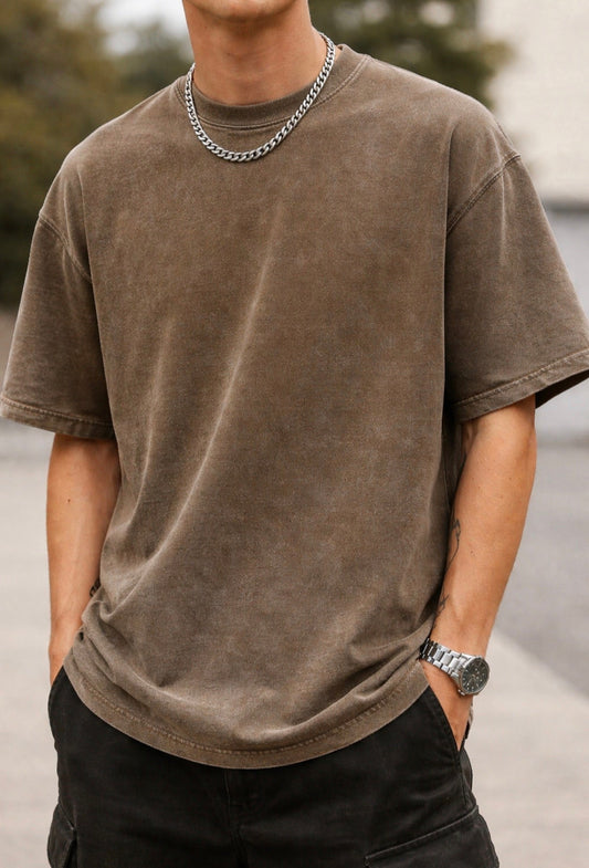 IvN Atelier vintage washed oversized T-shirt displayed on a hanger, showcasing relaxed fit and soft fabric texture.